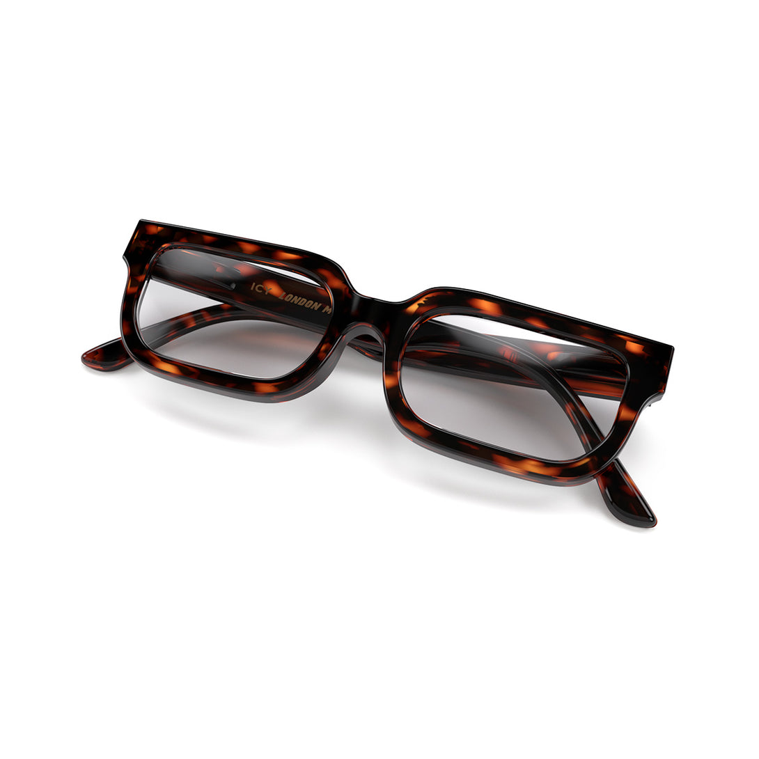 Folded skew - Icy Reading Glasses in gloss tortoiseshell featuring a bold rectangle frame and provide crystal clear vision. Available in a + 1, 1.5, 2, 2.5, 3 prescriptions.