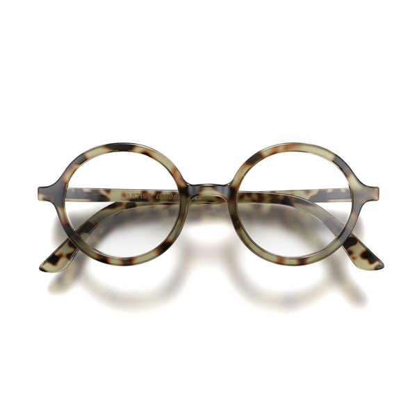 Front - Artist Reading Glasses in pale tortoiseshell featuring an oversized circular frame and provide crystal clear vision. Available in a + 1, 1.5, 2, 2.5, 3 prescriptions.