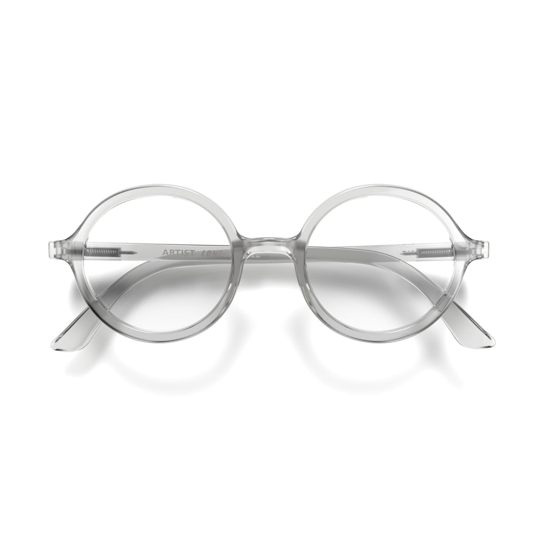 Front - Artist Reading Glasses featuring an oversized circular transparent frame and provide crystal clear vision. Available in a + 1, 1.5, 2, 2.5, 3 prescriptions.