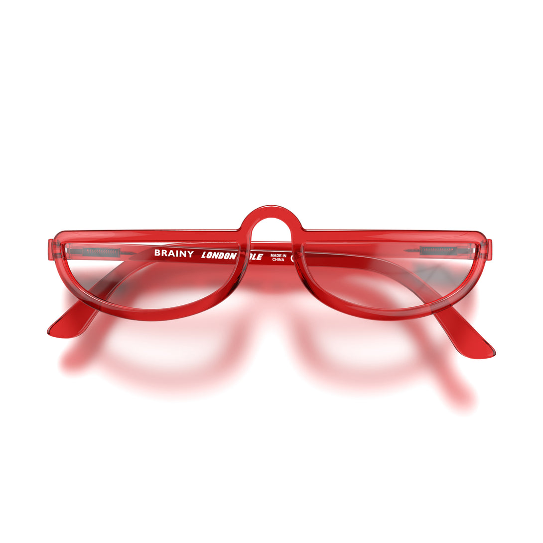 Front - Brainy Blue Blocker Glasses in transparent red featuring a half-moon frame and the ability to protect your eyes from artificial blue light. Ideal for fashion accessories, screen time, office work, gaming, scrolling on a mobile, and watching TV. 