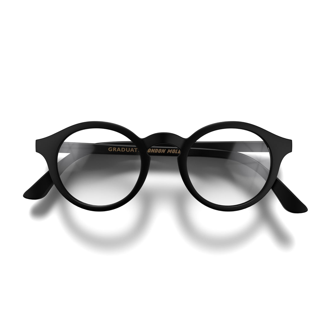 Front - Graduate Blue Blocker Glasses in matt black featuring a soft circle frame and the ability to protect your eyes from artificial blue light. Ideal for fashion accessories, screen time, office work, gaming, scrolling on a mobile, and watching TV. 