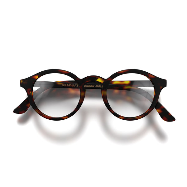 Front - Graduate Reading Glasses in matt tortoiseshell featuring a soft circle frame and provide crystal clear vision. Available in a + 1, 1.5, 2, 2.5, 3 prescriptions.