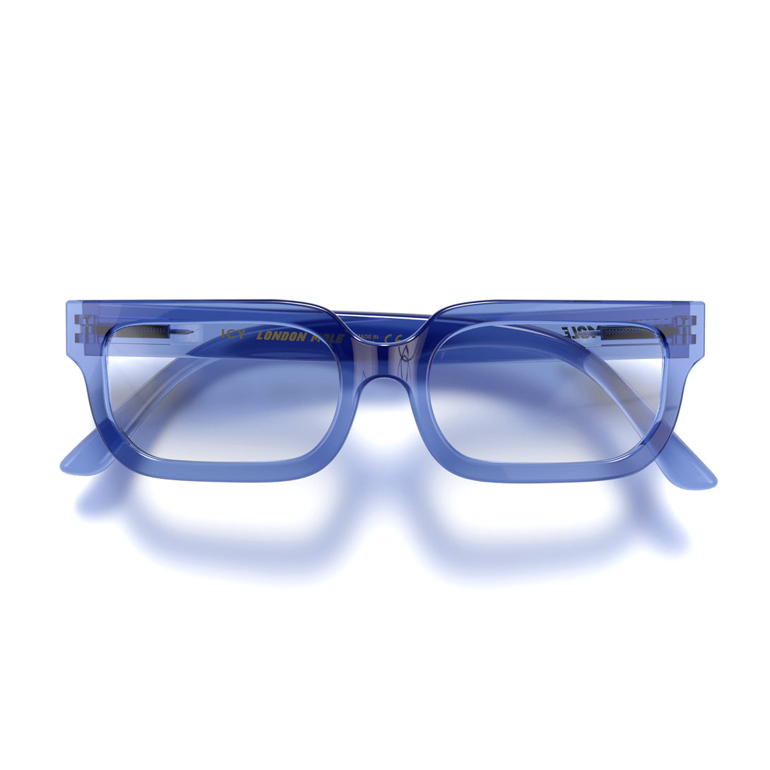 Front - Icy Reading Glasses in transparent blue featuring a bold rectangle frame and provide crystal clear vision. Available in a + 1, 1.5, 2, 2.5, 3 prescriptions.