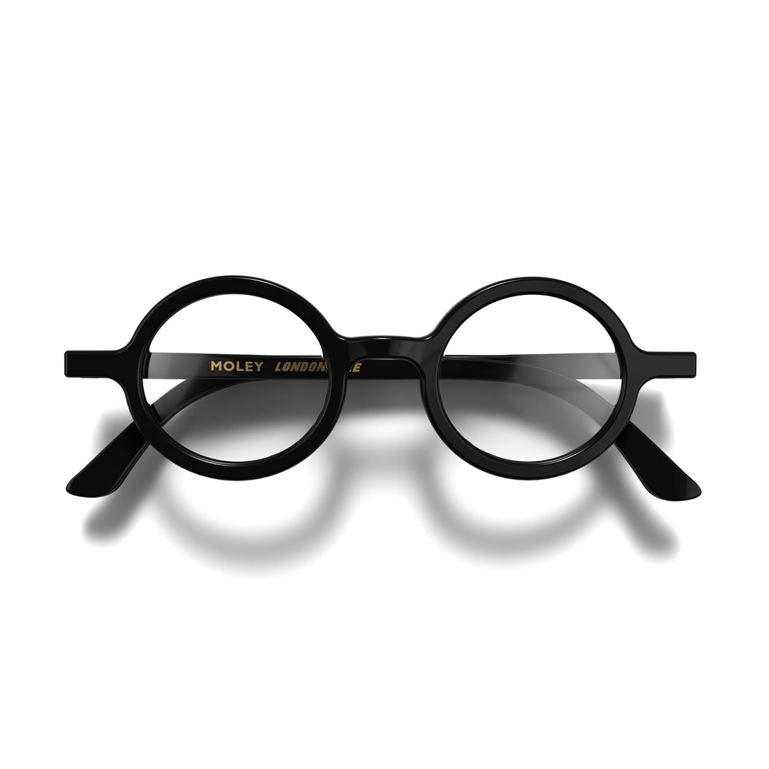 Front - Moley Reading Glasses in gloss black featuring an eccentrically round frame and provide crystal clear vision. Available in a + 1, 1.5, 2, 2.5, 3 prescriptions.