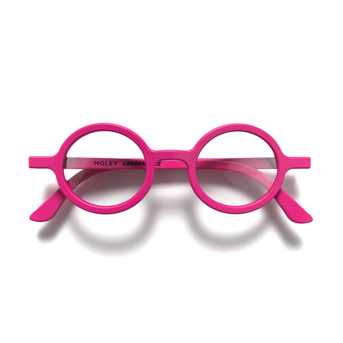 Front - Moley Reading Glasses in matt pink featuring an eccentrically round frame and provide crystal clear vision. Available in a + 1, 1.5, 2, 2.5, 3 prescriptions.