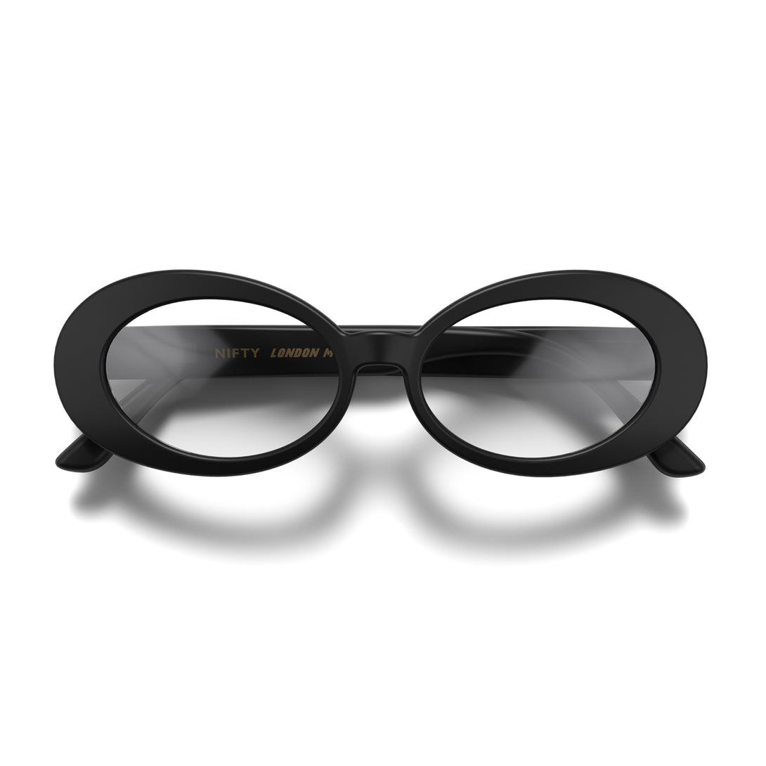 Front - Nifty Blue Blocker Glasses in matt black featuring a bold, vintage oval frame and the ability to protect your eyes from artificial blue light. Ideal for fashion accessories, screen time, office work, gaming, scrolling on a mobile, and watching TV. 