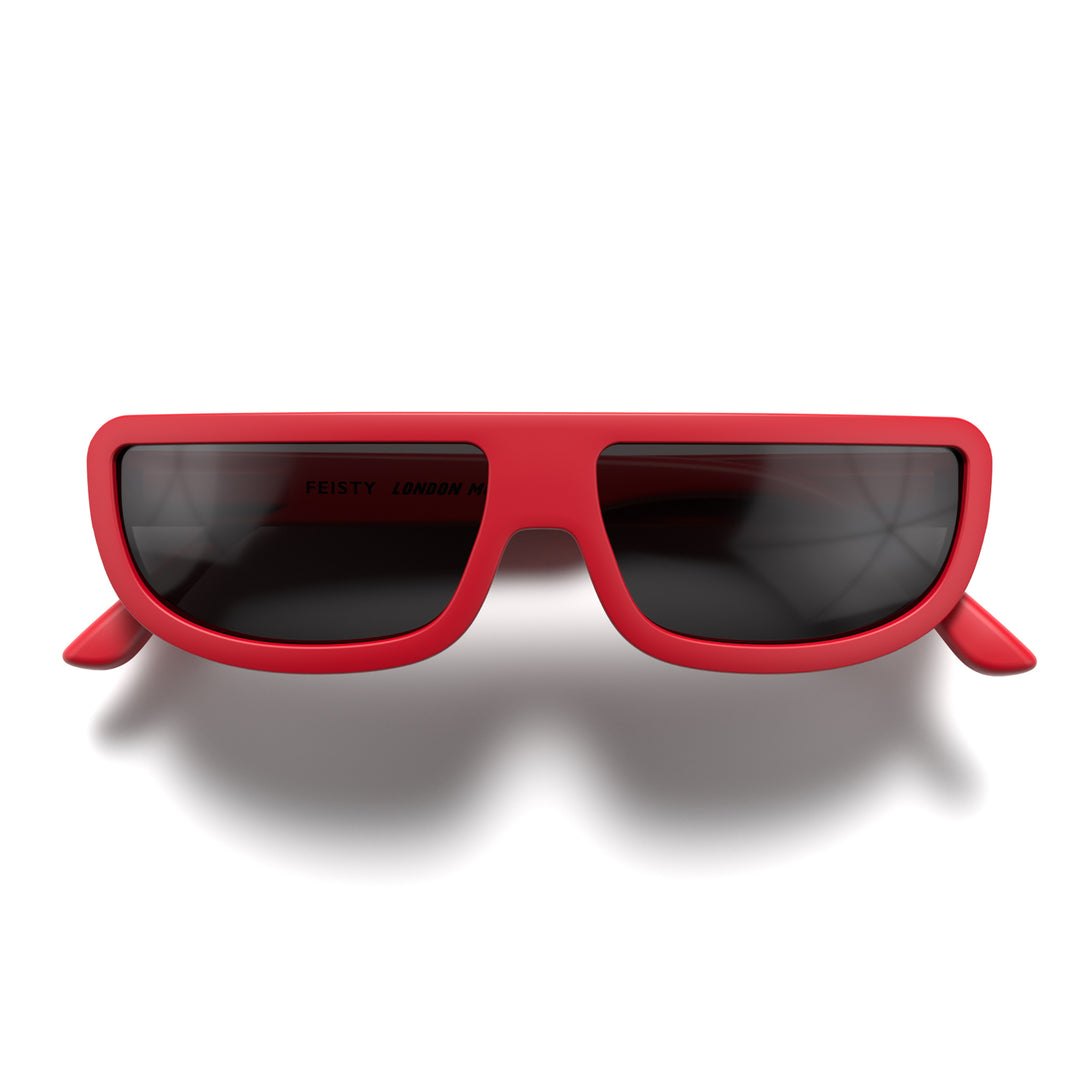 Front - Feisty sunglasses in matt red featuring a utilitarian, straight top line frame and black UV400 lenses. The finishing touch to every outfit while protecting your eyes. 