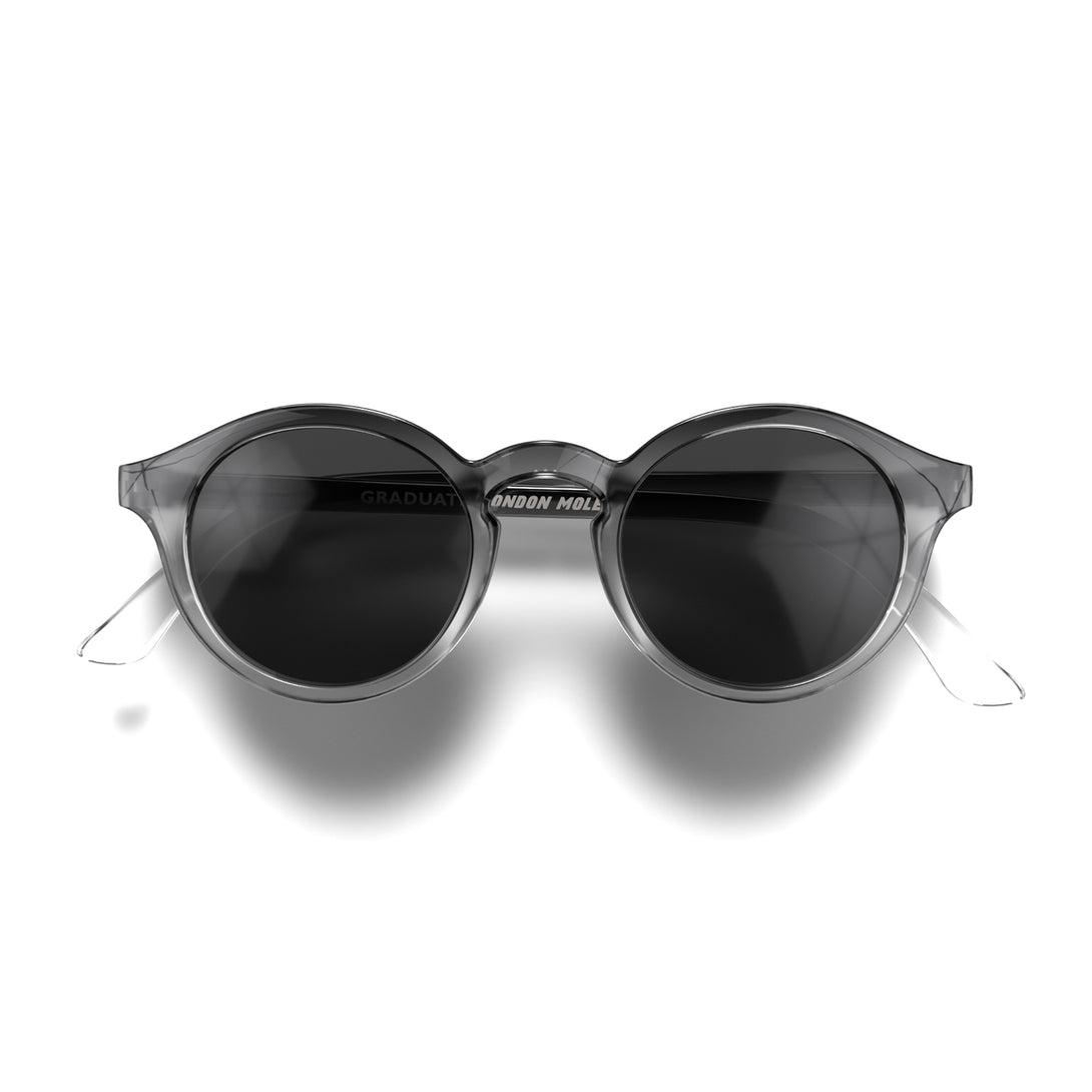 Front - Graduate sunglasses in black fade featuring a soft circle frame and black UV400 lenses. The finishing touch to every outfit while protecting your eyes. 