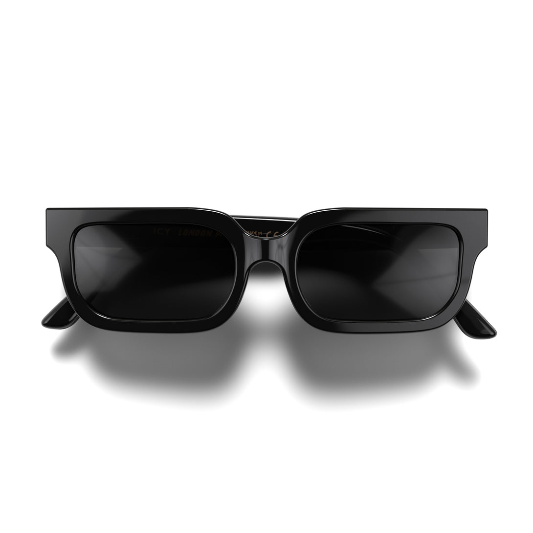 Front - Icy sunglasses in gloss black featuring a bold rectangle frame and black UV400 lenses. The finishing touch to every outfit while protecting your eyes. 