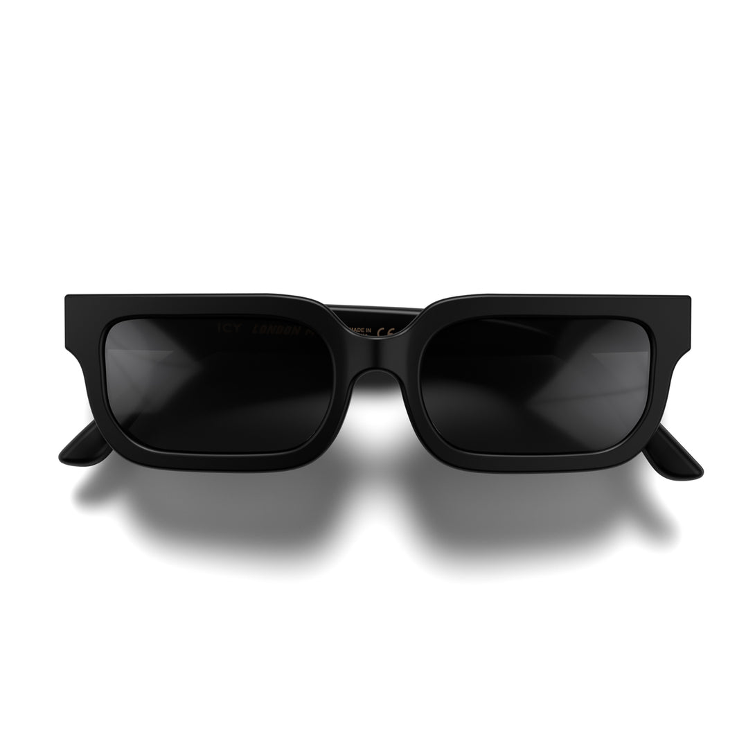 Front - Icy sunglasses in matt black featuring a bold rectangle frame and black UV400 lenses. The finishing touch to every outfit while protecting your eyes. 