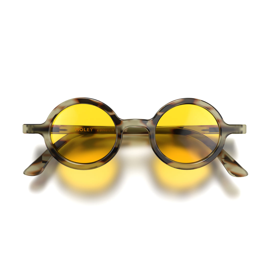 Front - Moly sunglasses pale tortoiseshell featuring an eccentrically round frame and yellow UV400 lenses. The perfect accessory.