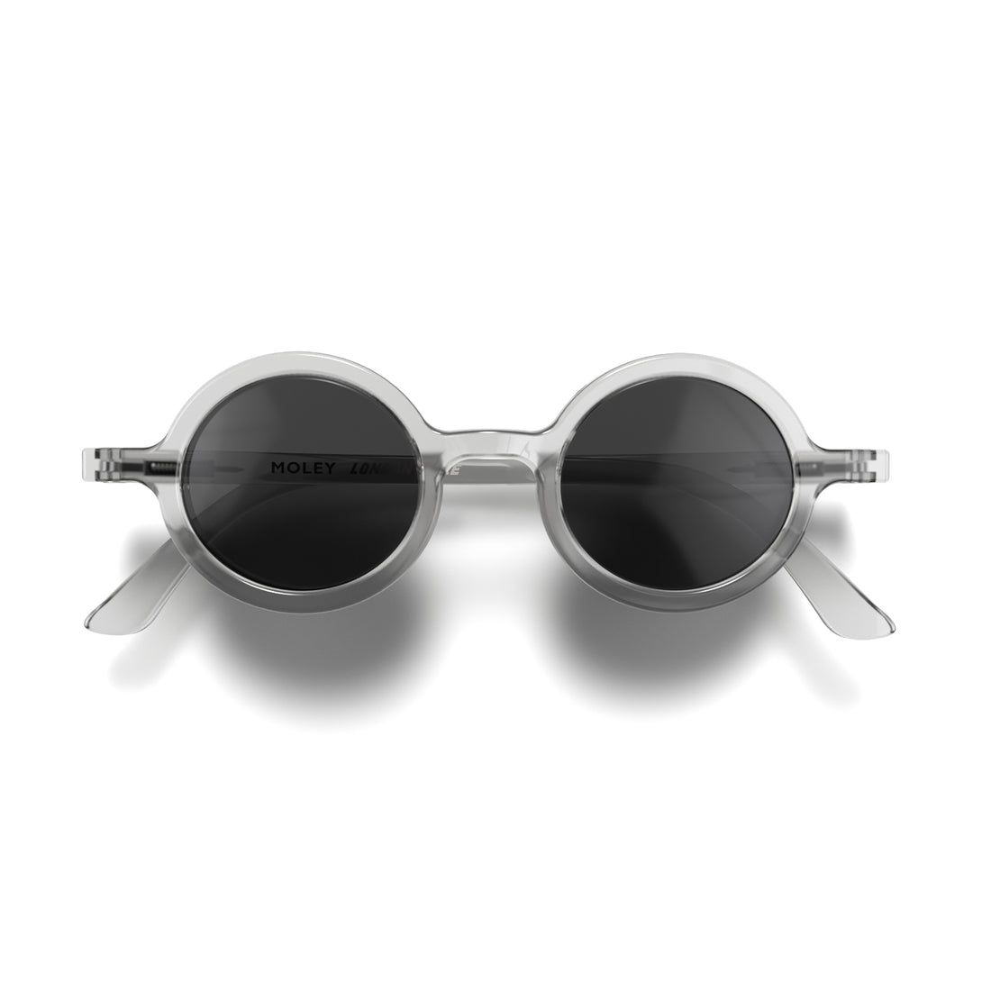Front - Moly sunglasses featuring an eccentrically round, transparent frame and black UV400 lenses. The perfect accessory.