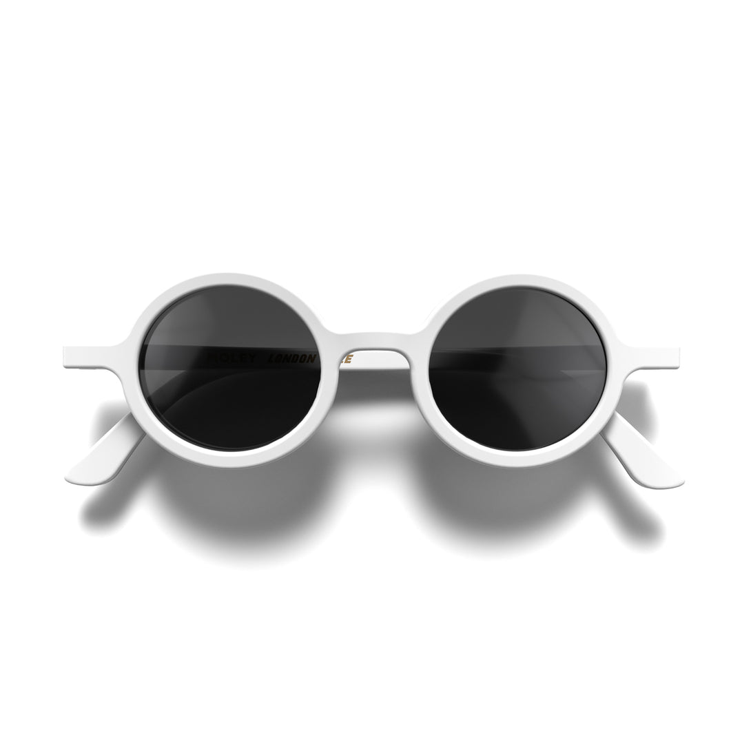 Front - Moly sunglasses in matt white featuring an eccentrically round frame and black UV400 lenses. The perfect accessory.