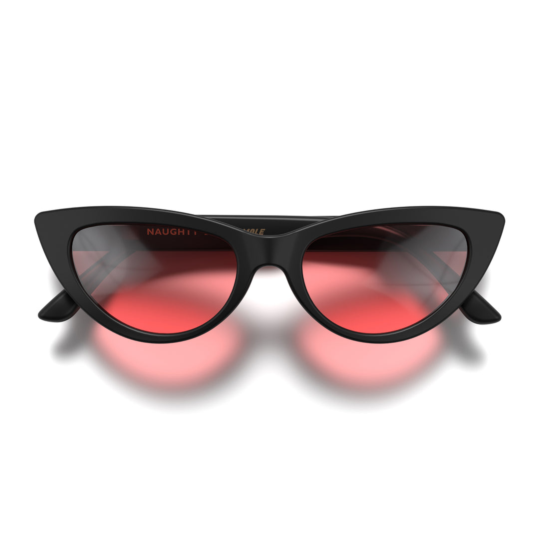 Front - Naughty sunglasses in matt black featuring a classic cat-eye frame and red UV400 lenses. The perfect accessory.