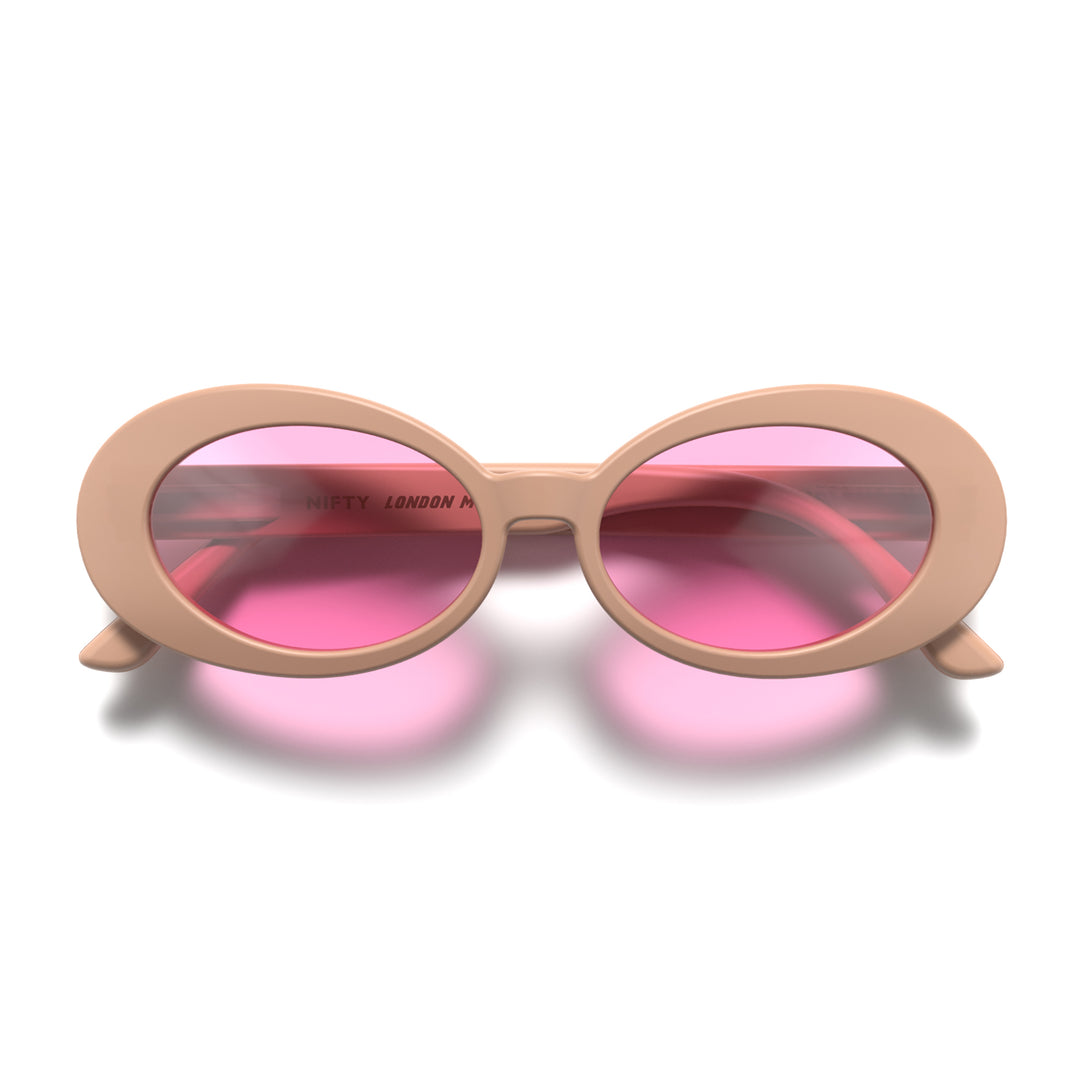 Front - Nifty sunglasses in soft pink featuring a bold, vintage oval frame and pink UV400 lenses. The perfect accessory.