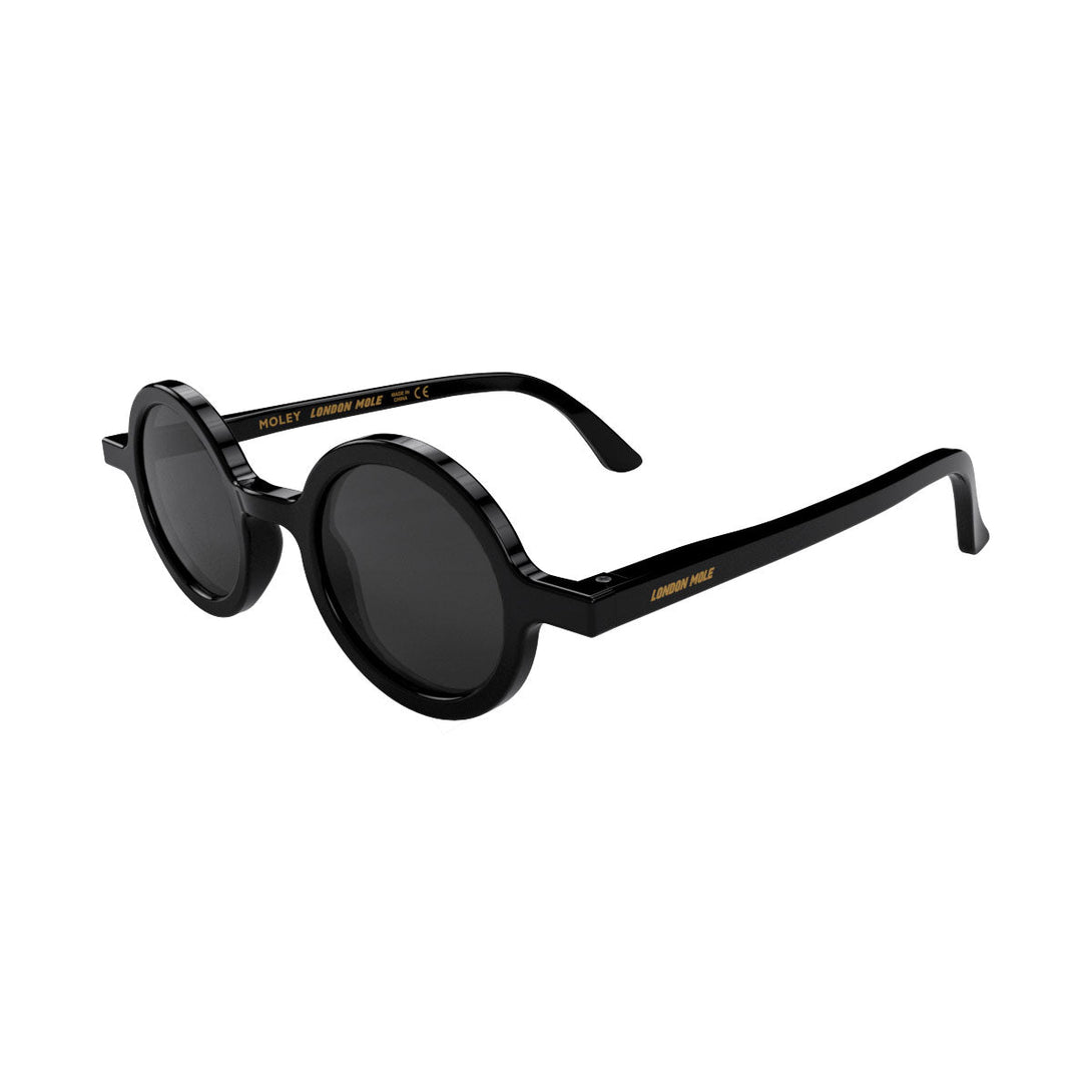 Open skew - Moly sunglasses gloss black  featuring an eccentrically round frame and black UV400 lenses. The perfect accessory.