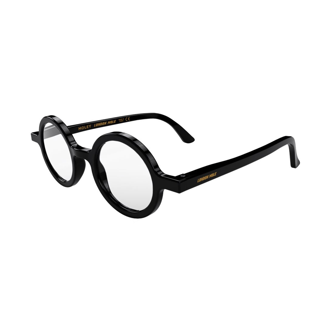 Open skew - Moley Blue Blocker Glasses in gloss black featuring an eccentrically round frame and the ability to protect your eyes from artificial blue light. Ideal for fashion accessories, screen time, office work, gaming, scrolling on a mobile, and watching TV. 