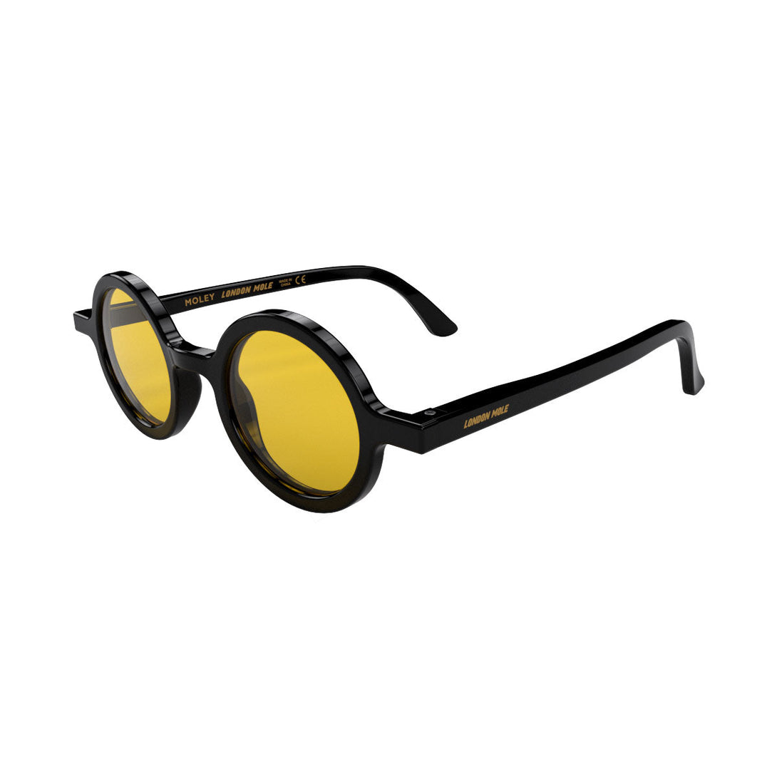 Open skew - Moly sunglasses gloss black  featuring an eccentrically round frame and yellow UV400 lenses. The perfect accessory.