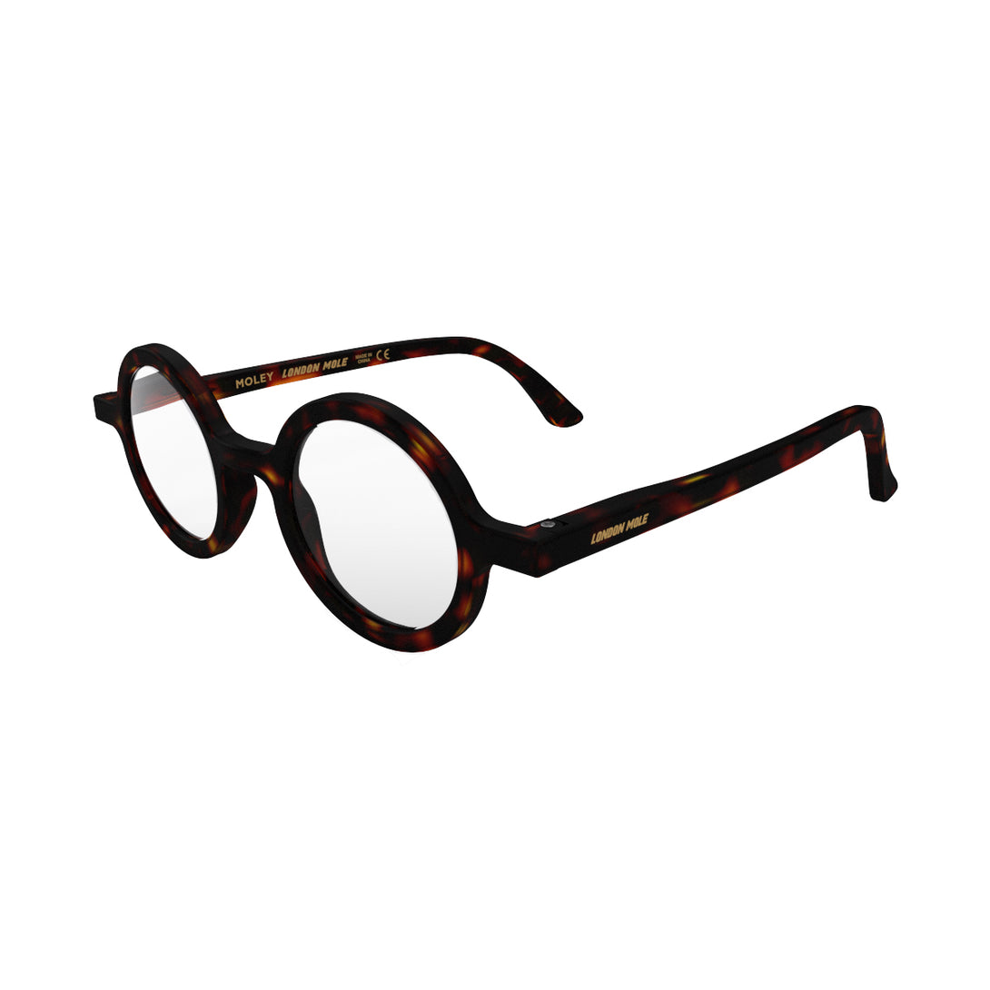 Open skew - Moley Reading Glasses in matt tortoiseshell featuring an eccentrically round frame and provide crystal clear vision. Available in a + 1, 1.5, 2, 2.5, 3 prescriptions.