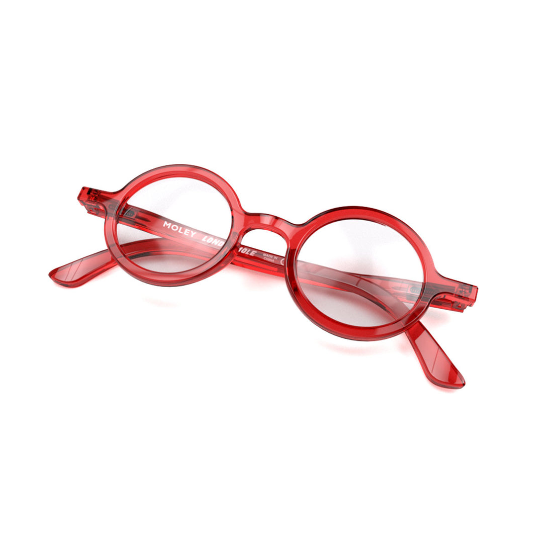 Closed skew view of the London Mole Moley Blue Blocker Glasses in Transparent Red