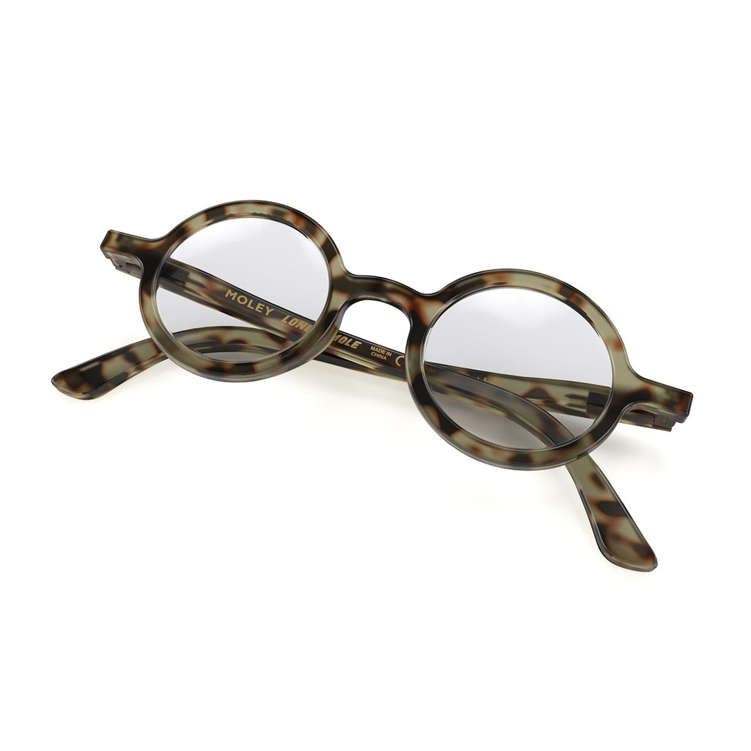 Folded skew - Moley Blue Blocker Glasses in gloss tortoiseshell featuring an eccentrically round frame and the ability to protect your eyes from artificial blue light. Ideal for fashion accessories, screen time, office work, gaming, scrolling on a mobile, and watching TV. 
