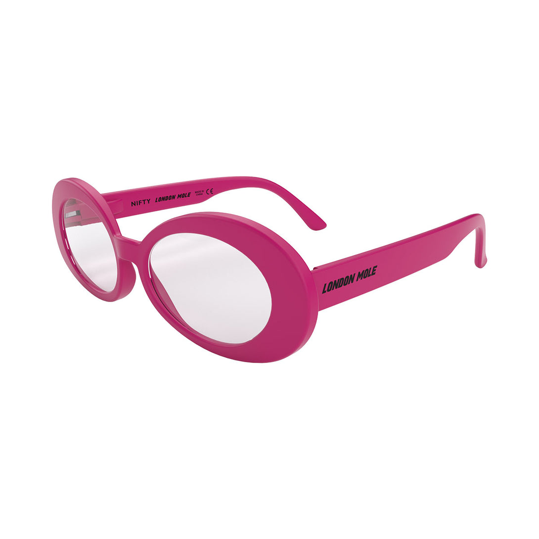 Open skew - Nifty Blue Blocker Glasses in matt pink featuring a bold, vintage oval frame and the ability to protect your eyes from artificial blue light. Ideal for fashion accessories, screen time, office work, gaming, scrolling on a mobile, and watching TV. 