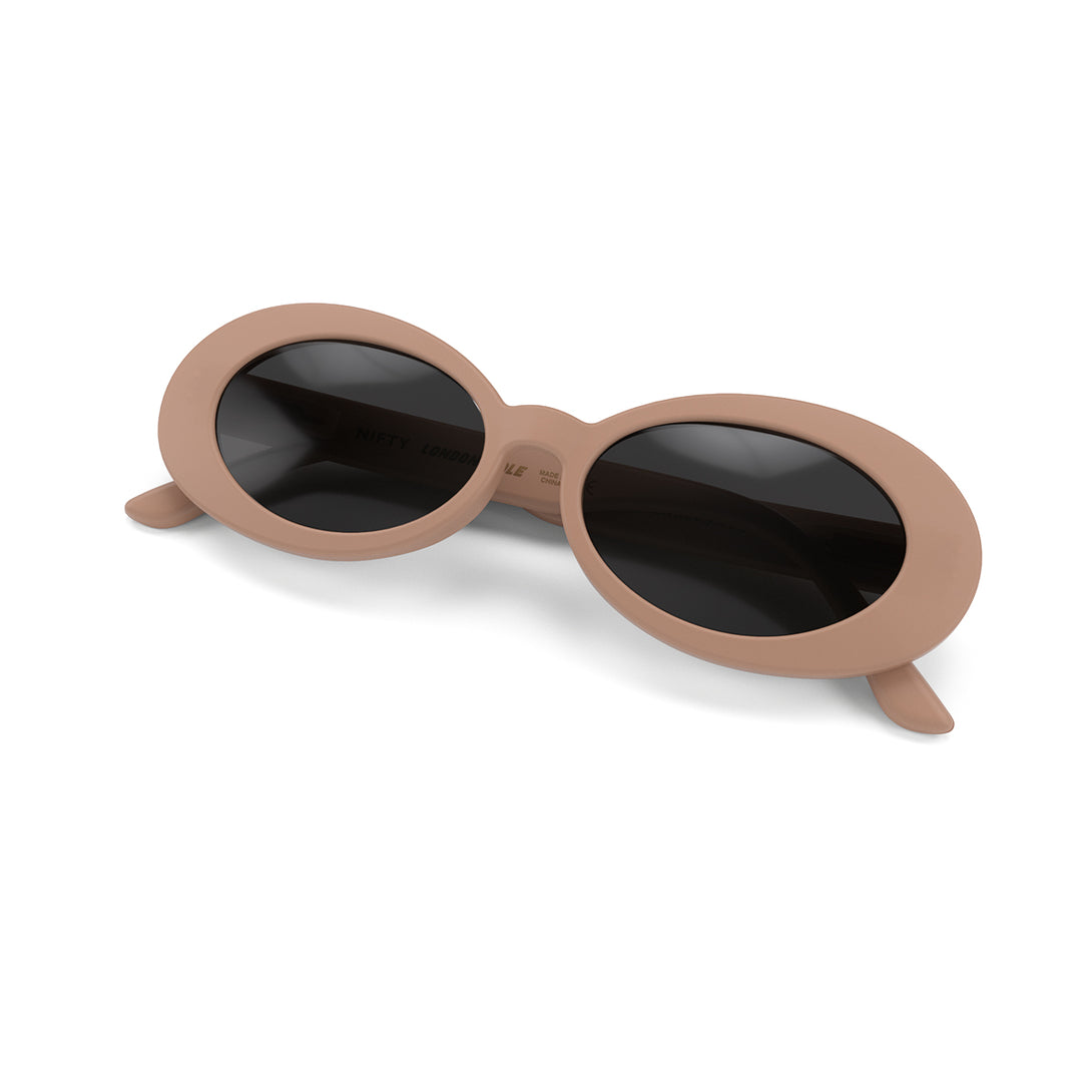 Front view folded of Nifty Sunglasses by London Mole with Soft Pink Frames and Black Lenses