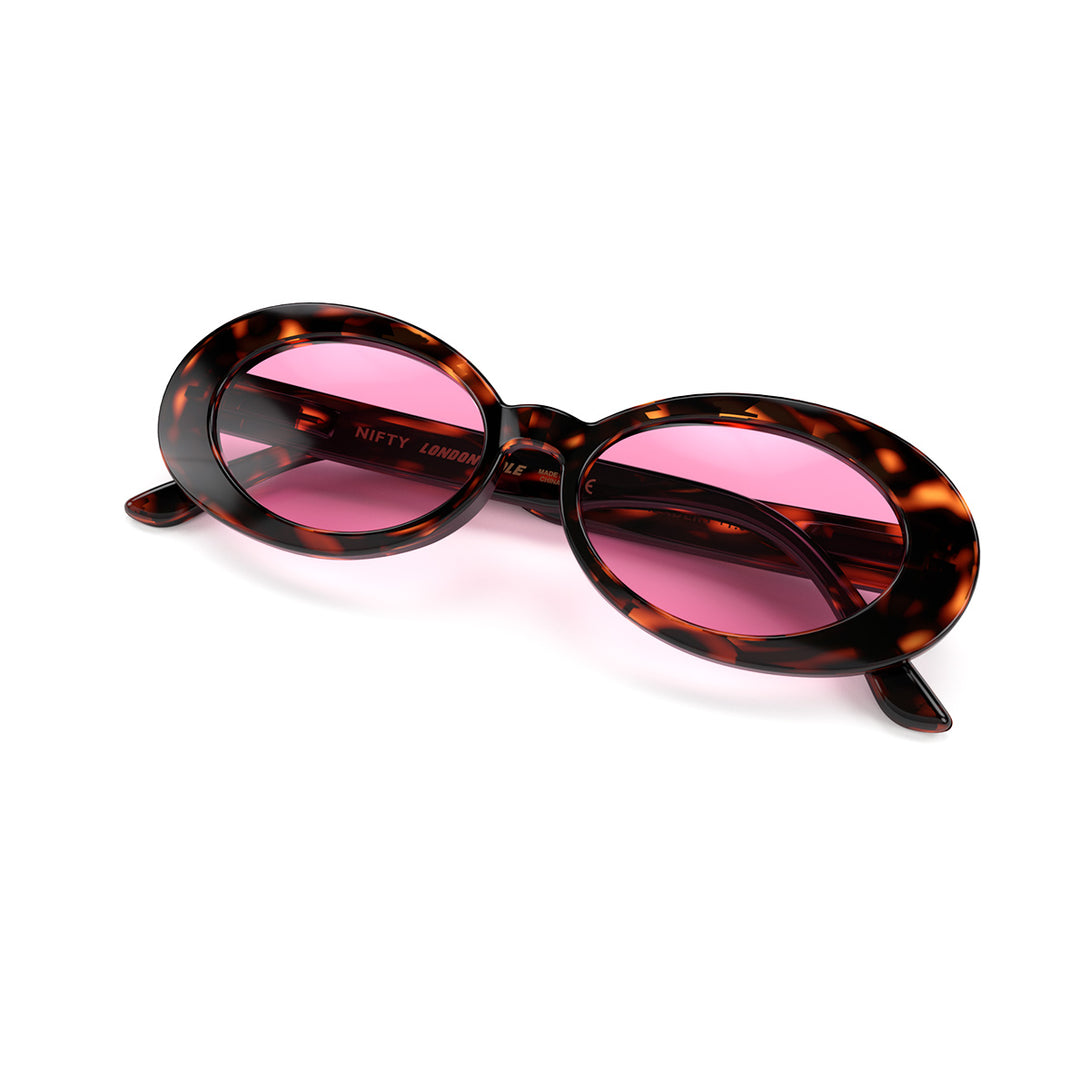Front view folded of Nifty Sunglasses by London Mole with Gloss Tortoise Shell Frames and Pink Lenses