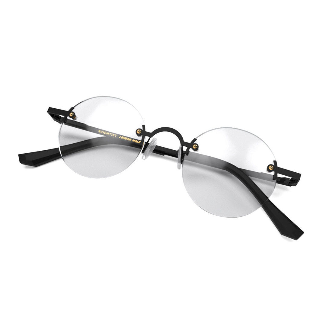 Folded skew - Scientist Reading Glasses in matt black offering a frameless lens and matt black temples while providing crystal clear vision. Available in a + 1, 1.5, 2, 2.5, 3 prescriptions.