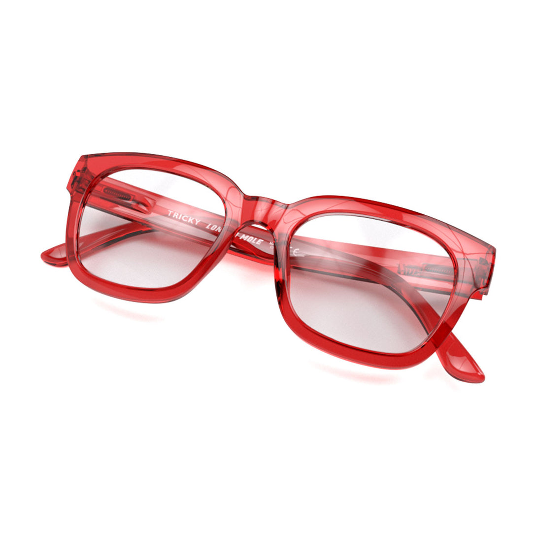 Closed skew view of the London Mole Tricky Blue Blocker Glasses in Transparent Red