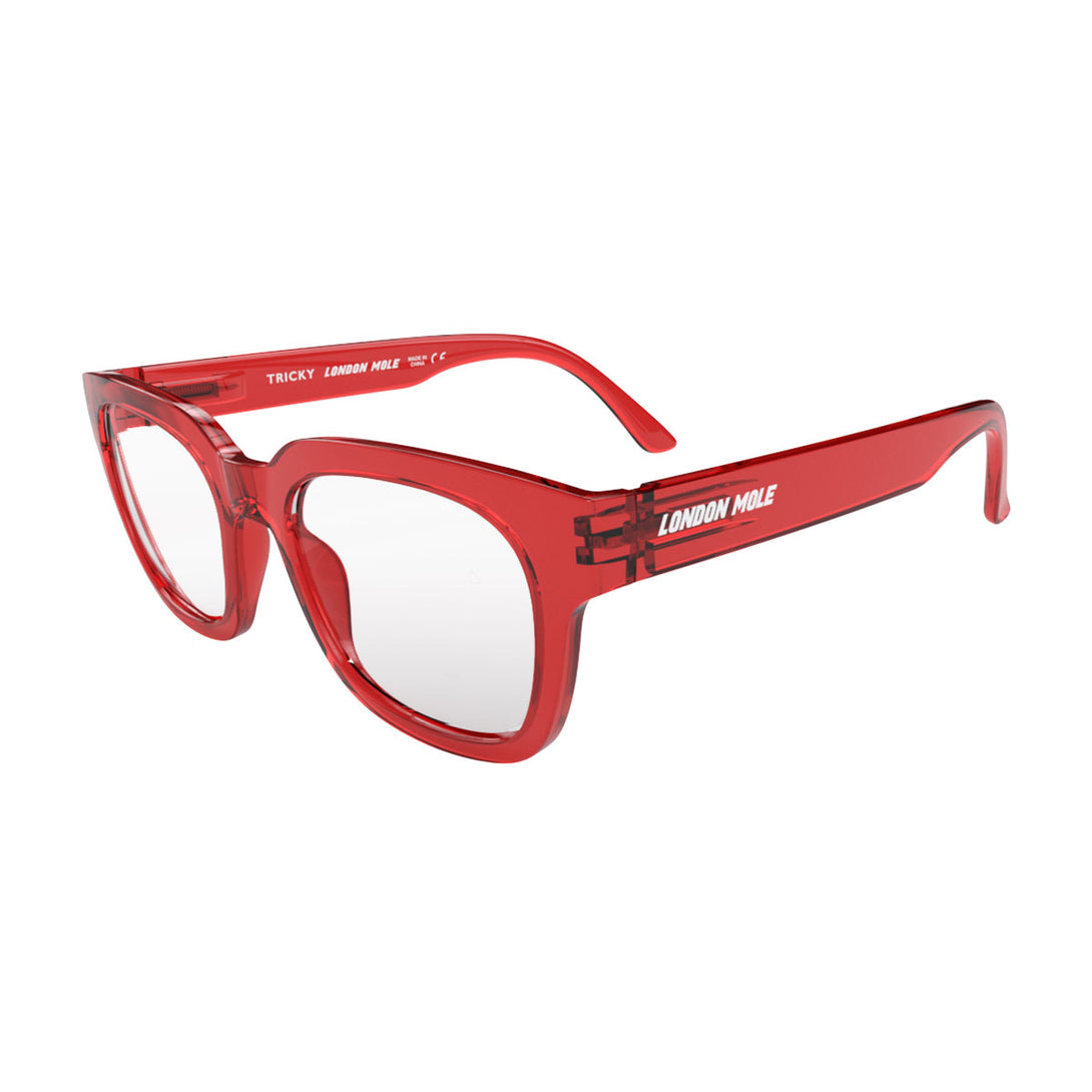 Open skew view of the London Mole Tricky Blue Blocker Glasses in Transparent Red