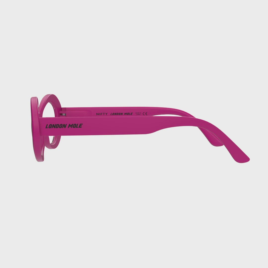 360 Turning Animation - Nifty Blue Blocker Glasses in matt pink featuring a bold, vintage oval frame and the ability to protect your eyes from artificial blue light. Ideal for fashion accessories, screen time, office work, gaming, scrolling on a mobile, and watching TV. 